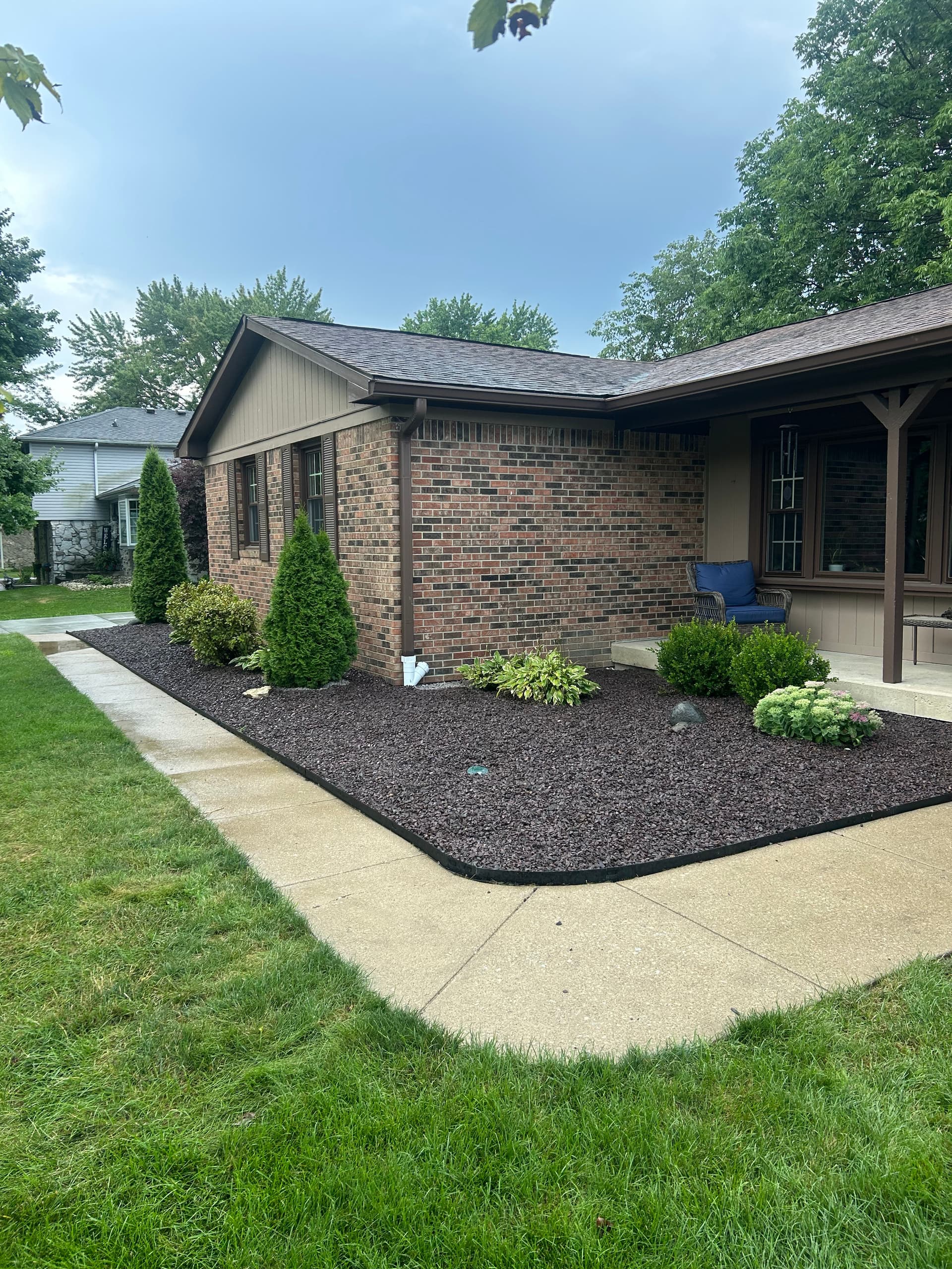 Creating an Inviting Entrance with Expert Edging and Rock Installation image